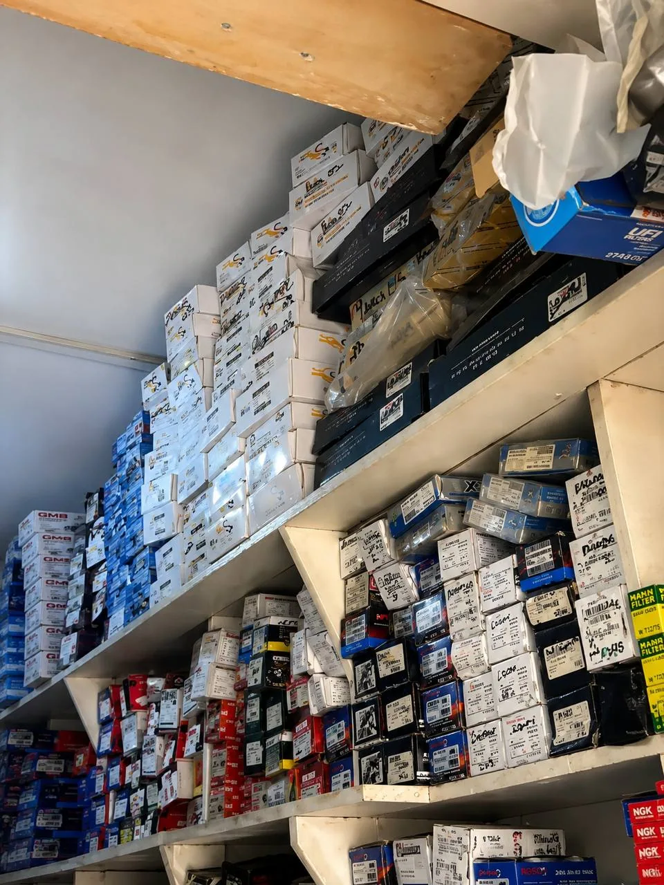 Boxes of automotive parts stocked on AKISS shelves